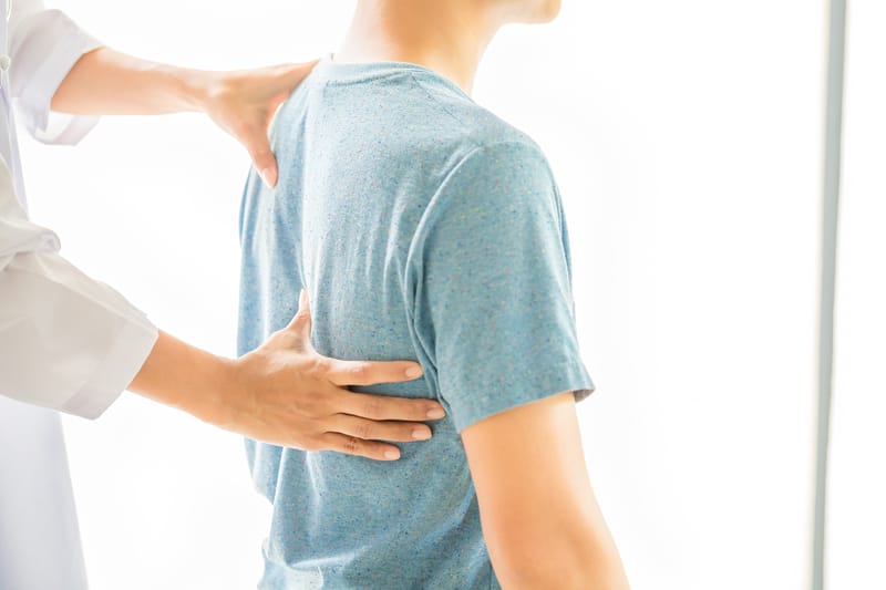 close up of physiotherapist working with patient in clinic 1jpg